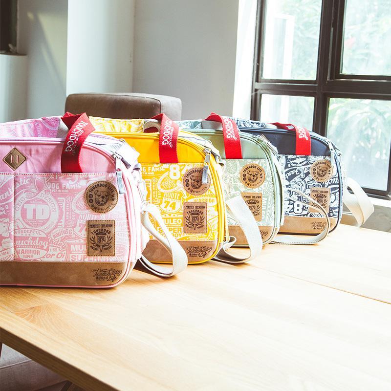 Touchdog printed pet carriers in pink, yellow, green and navy with shoulder straps