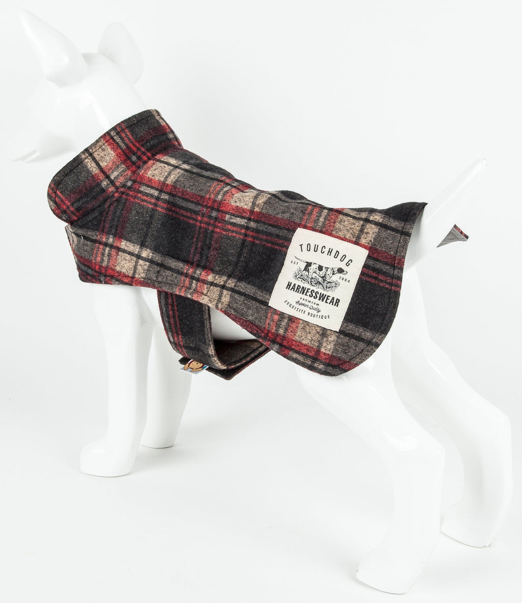 Dark red plaid dog jacket shown from the rear, with a belly strap and branded patch.