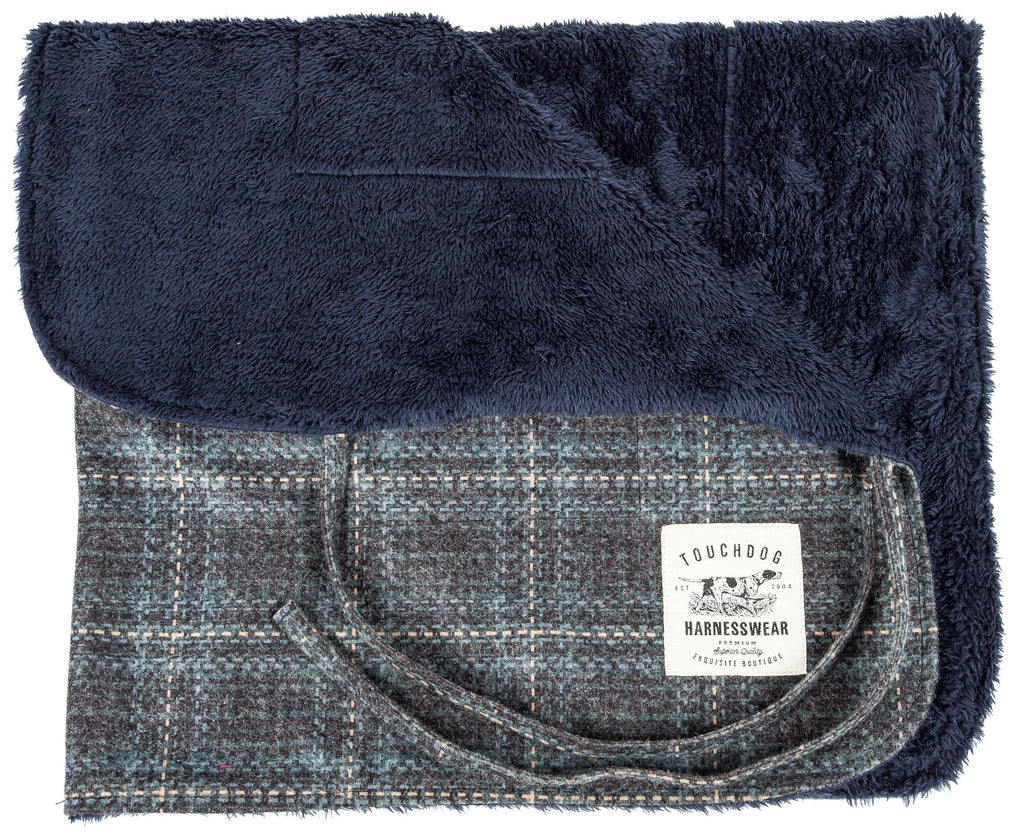 Touchdog reversible dog mat, folded to show plush navy fleece and plaid woven sides