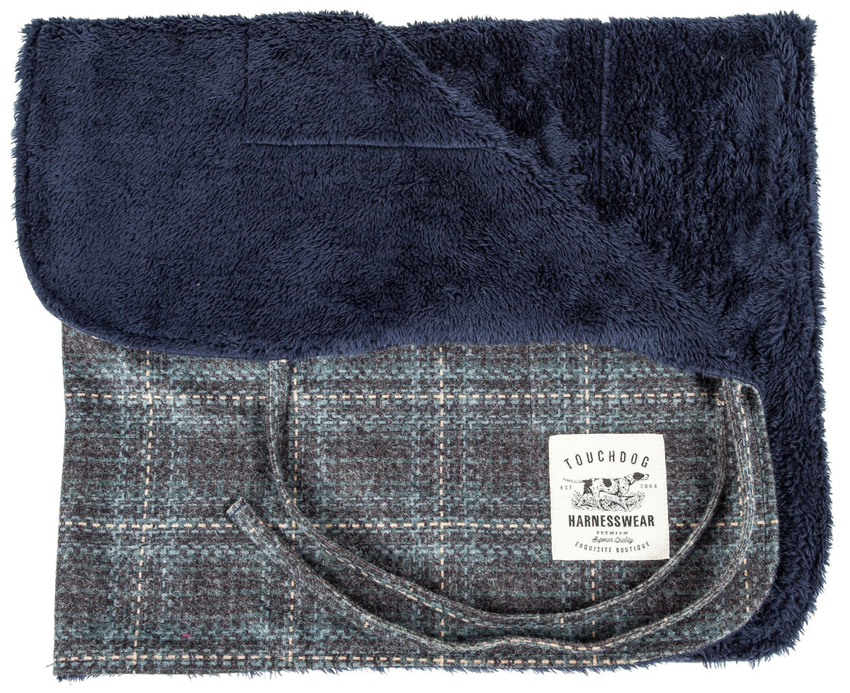 Touchdog reversible dog mat, folded to show plush navy fleece and plaid woven sides