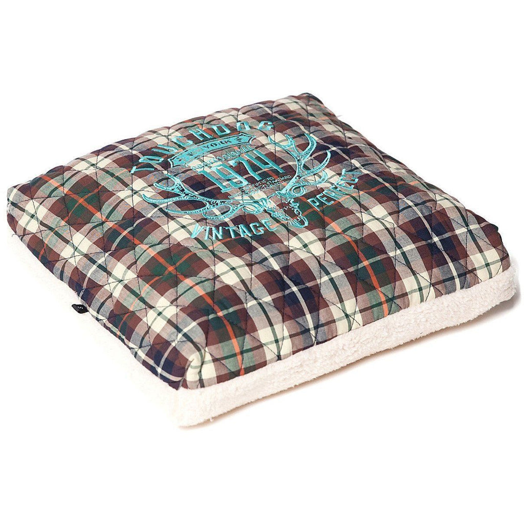 Plaid dog bed cushion with turquoise print and cream fleece base