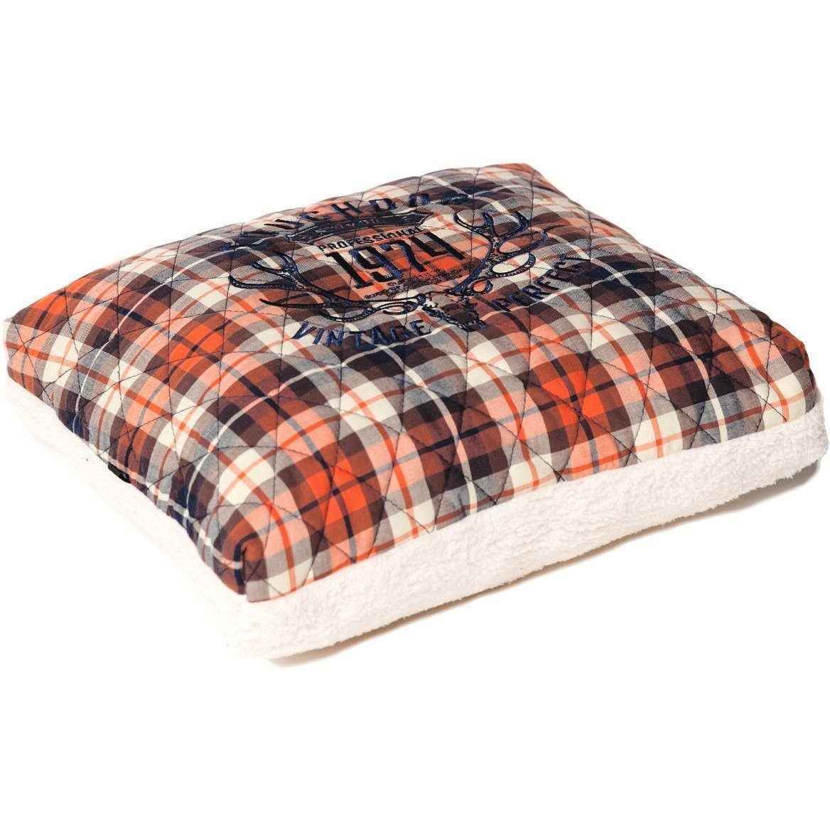 Plaid dog bed cushion with a cream fleece base and printed center
