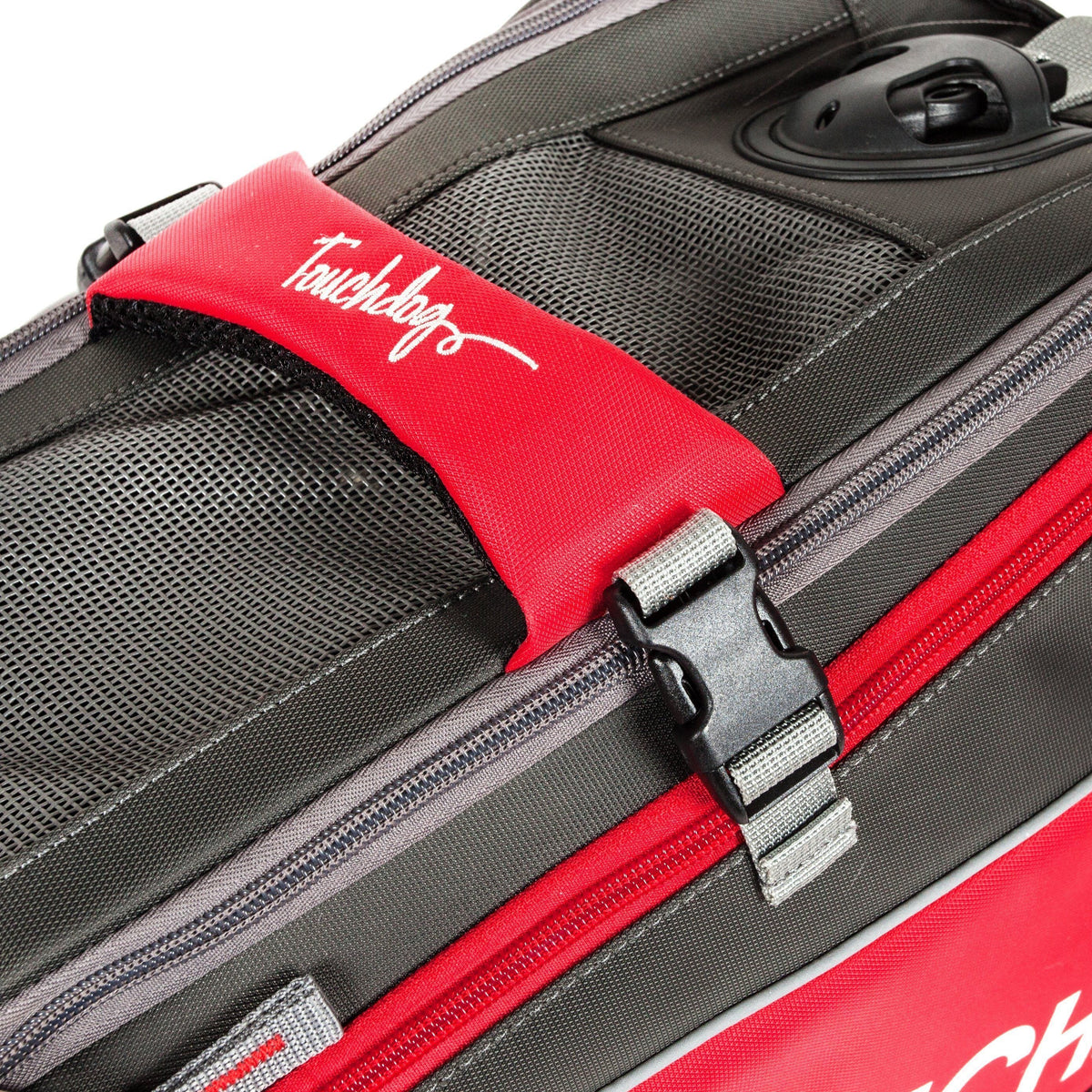 Touchdog carrier close-up showing mesh top, red handle wrap, buckle, and zipper