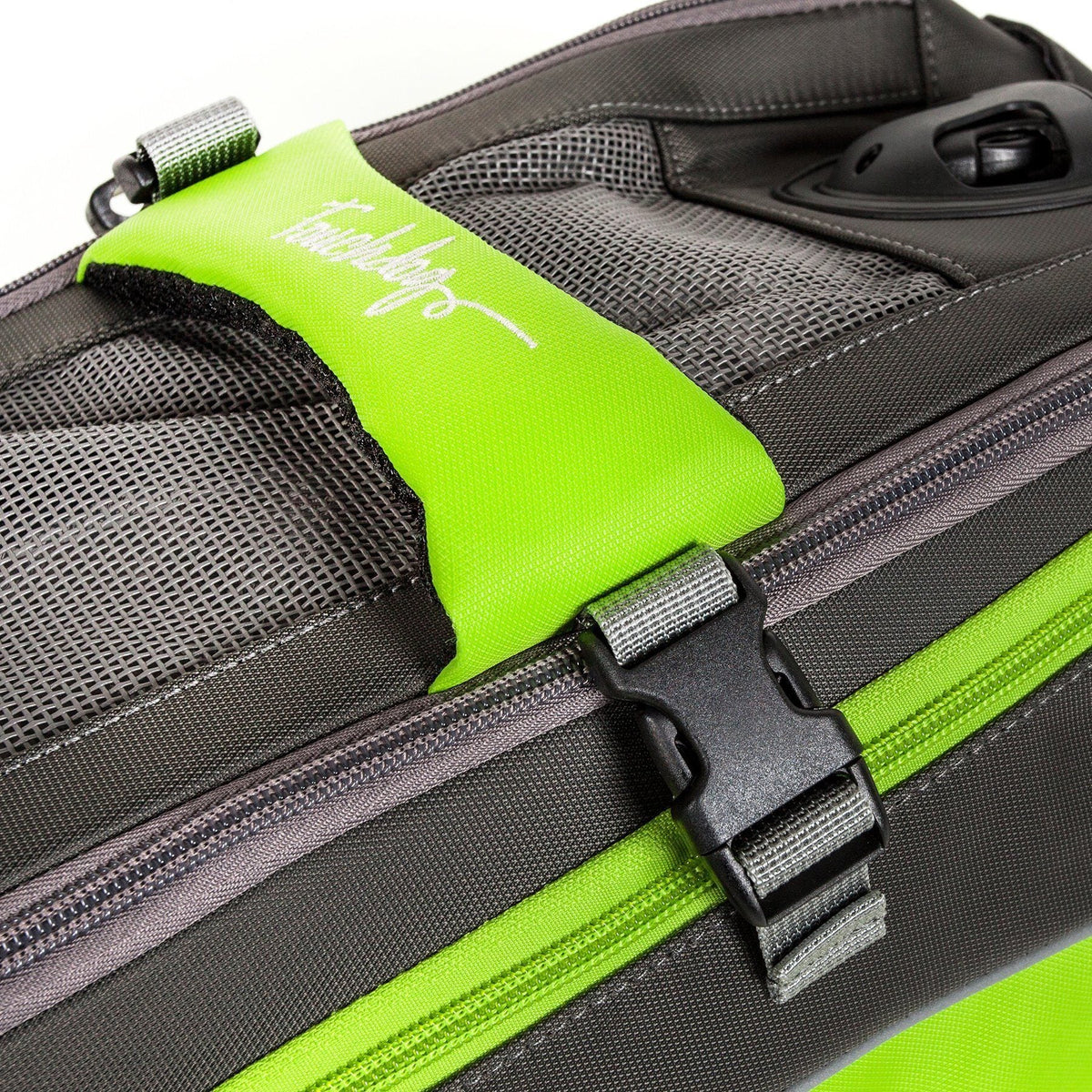 Touchdog pet carrier detail with lime green handle, mesh panels, zipper, and buckle