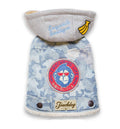 Blue camouflage dog sweater coat with gray hood, embroidered patch, and faux-fur trim