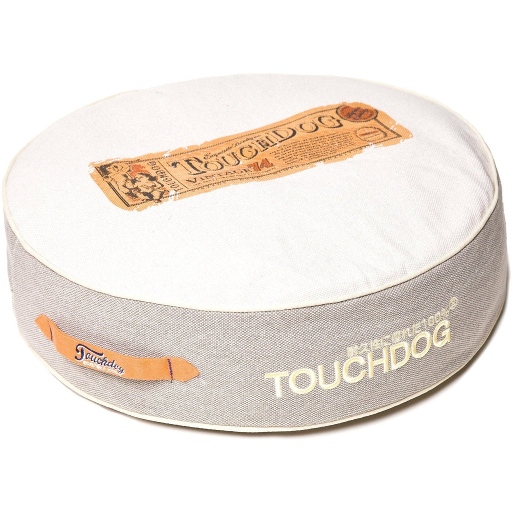 Touchdog round dog bed with a white top, gray denim sides, and orange accents
