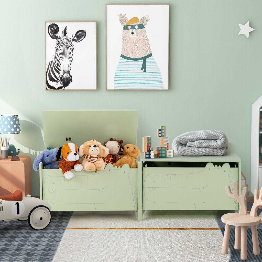 Green wooden kids toy box with safety hinge, lid open with plush animals inside.