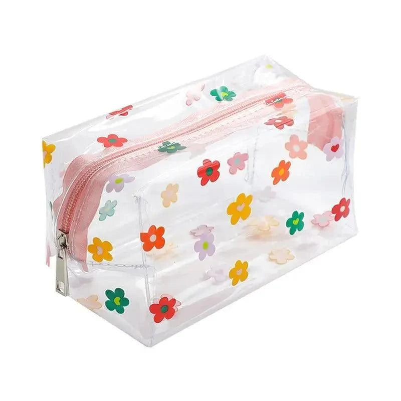 Transparent pencil case with multicolor flower print and pink zipper