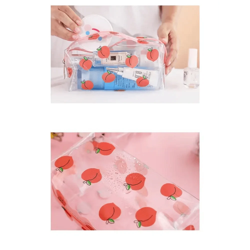 Transparent pencil case in a clear pouch opening with peach fruit print