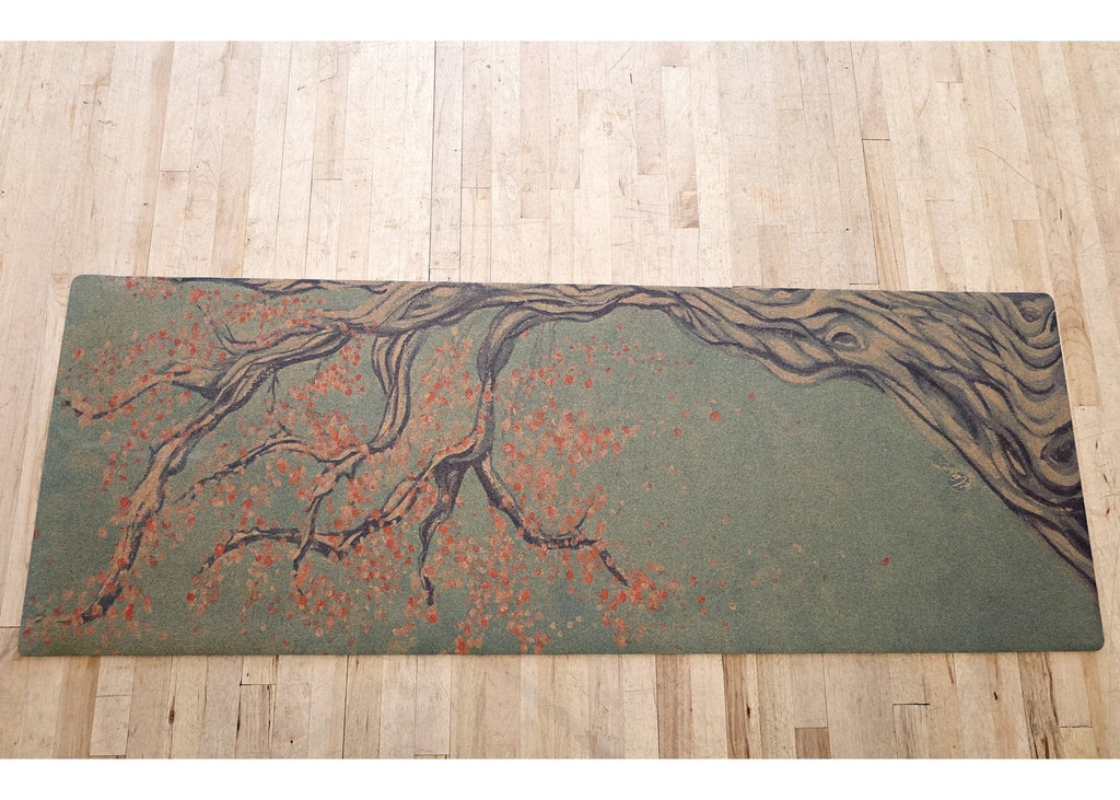 Full cork yoga mat with an illustrated tree and red blossoms