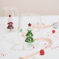 Clear stemless glass with green glitter tree and red star cutout inside