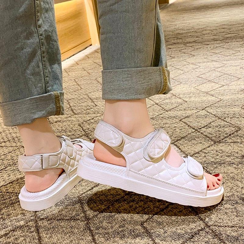 Light white platform sandals with hook-and-loop straps and thick sole, open toe