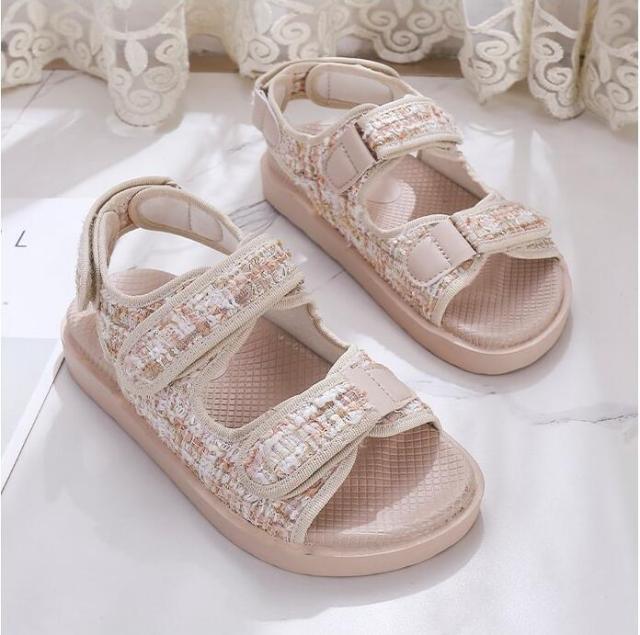 Beige platform sandals with sparkly textured straps and hook-and-loop closures, open toe