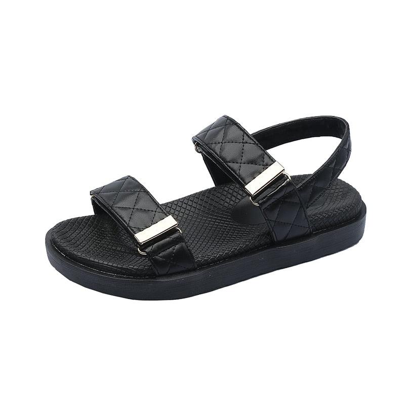 Black quilted platform sandals with two adjustable buckles and open toe