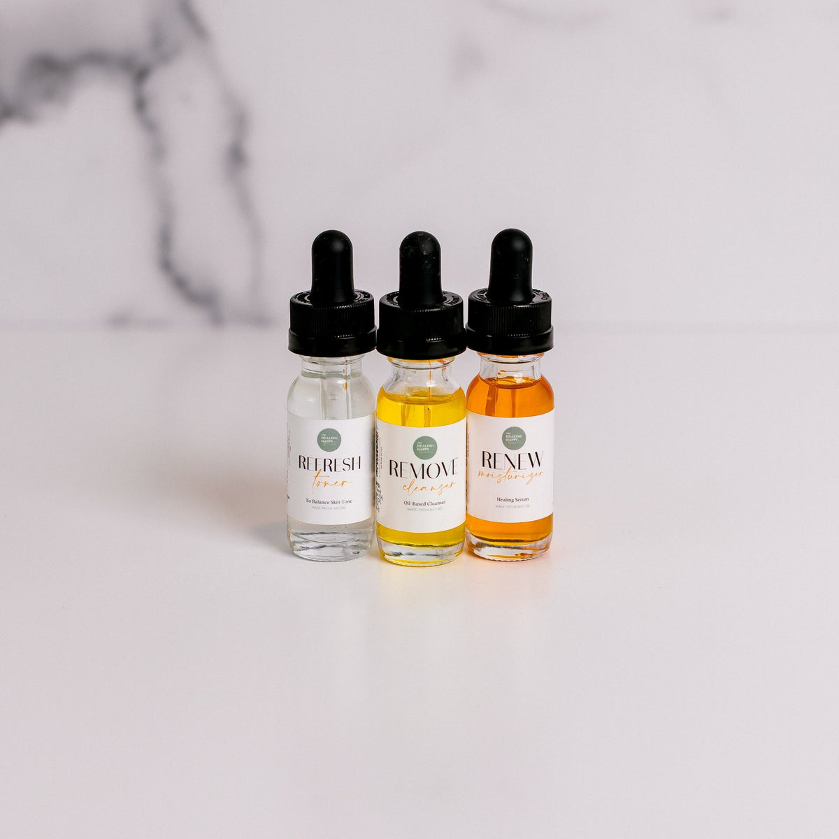 Skin care trial set with three dropper bottles and amber serum