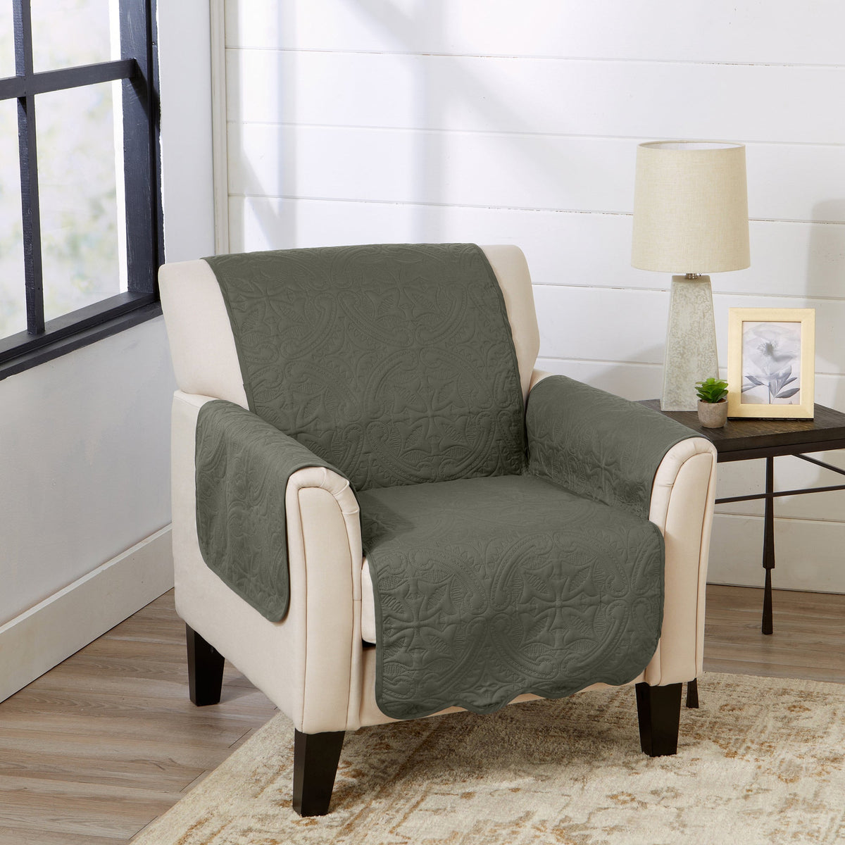 Medallion solid armchair protector in sage green over cream chair arms