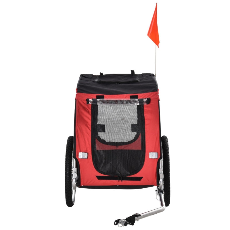 Red and black pet bike trailer cargo cart with open mesh window and flag handle