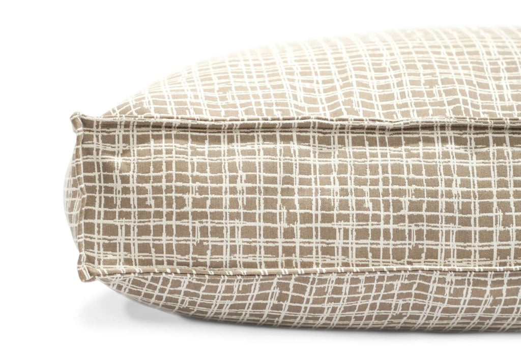 Round pet bed with plaid cover, stitched seams, and padded cushion edge