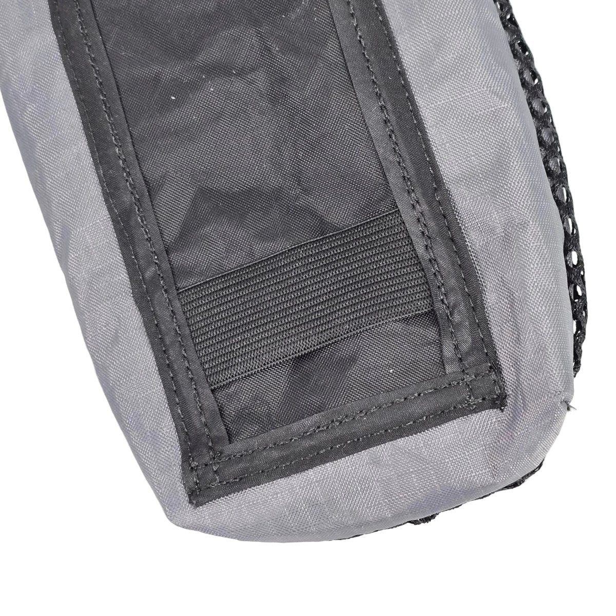 Ultralight bottle pouch close-up: gray fabric with front mesh and stitched panel