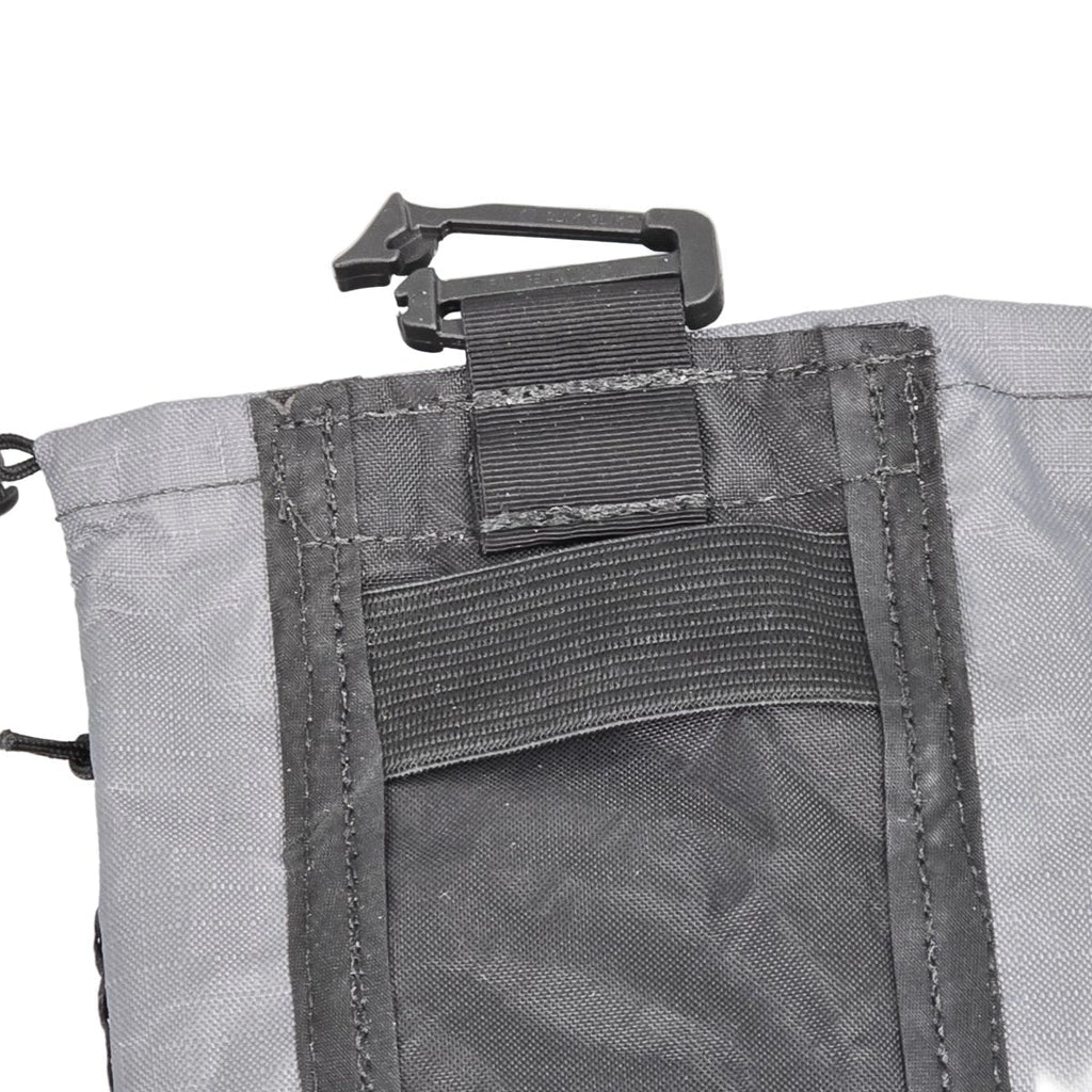 Ultralight bottle pouch close-up: gray panel with clip and elastic strap pocket