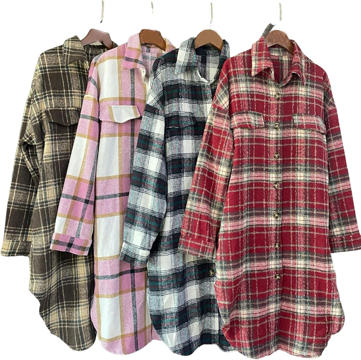 Assorted plaid flannel shackets on hangers: black, pink, teal, and red button-front