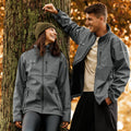 Dark gray soft shell jacket, full-zip with hood and two zip pockets