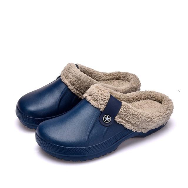 Navy fur-lined winter clogs with plush sherpa collar and star badge strap