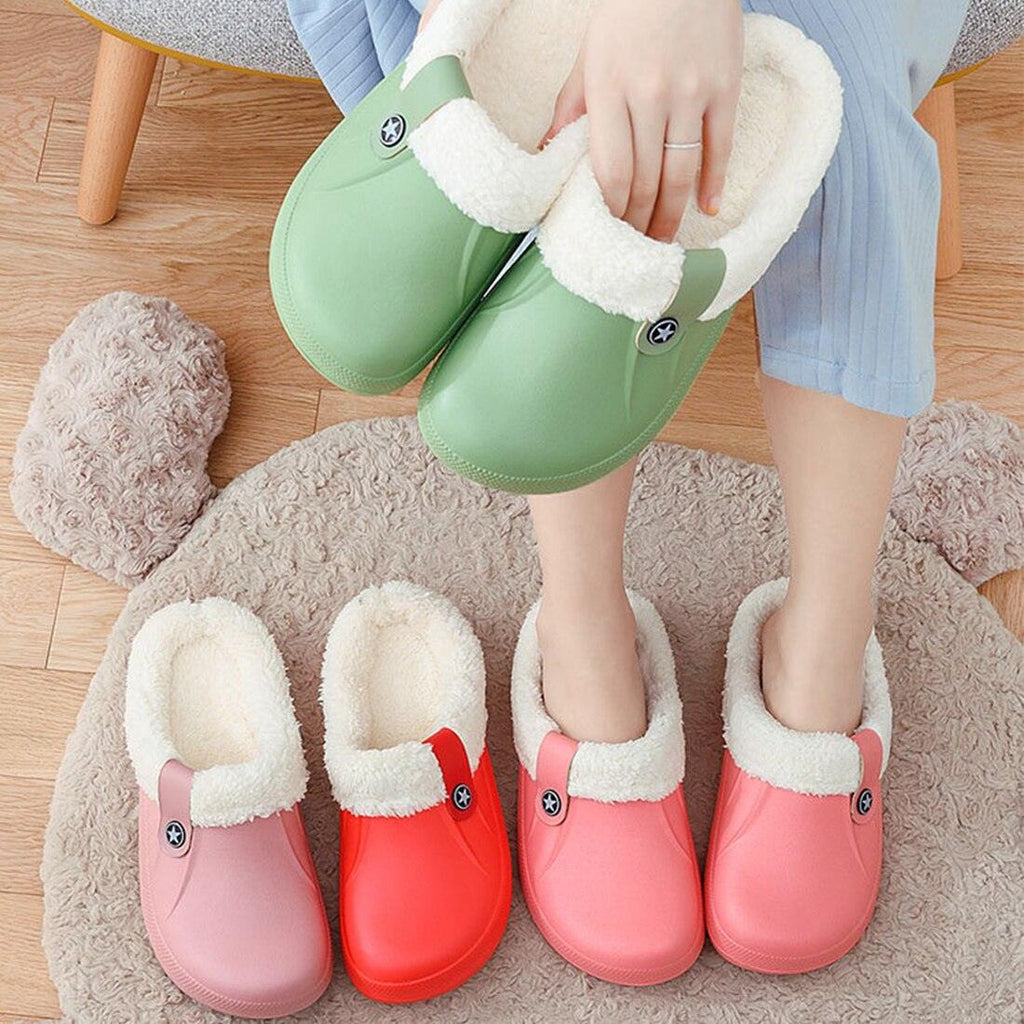 Green fur-lined winter clogs with plush shearling lining and star badge strap
