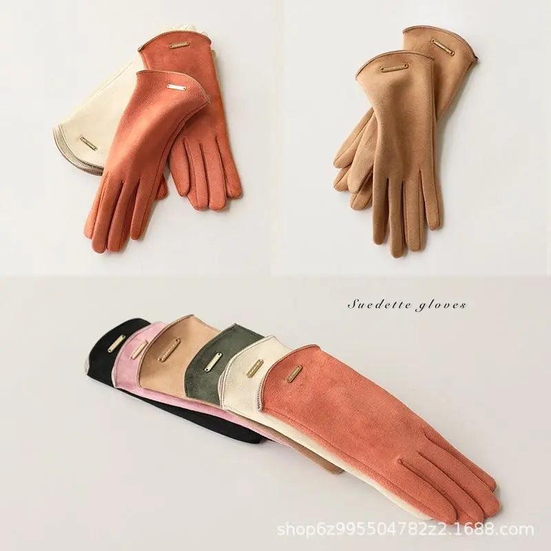 Suede touchscreen gloves in rust orange, with metal tab on back and split-finger design.