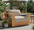 Outdoor teak revolving chair with beige seat and back cushions