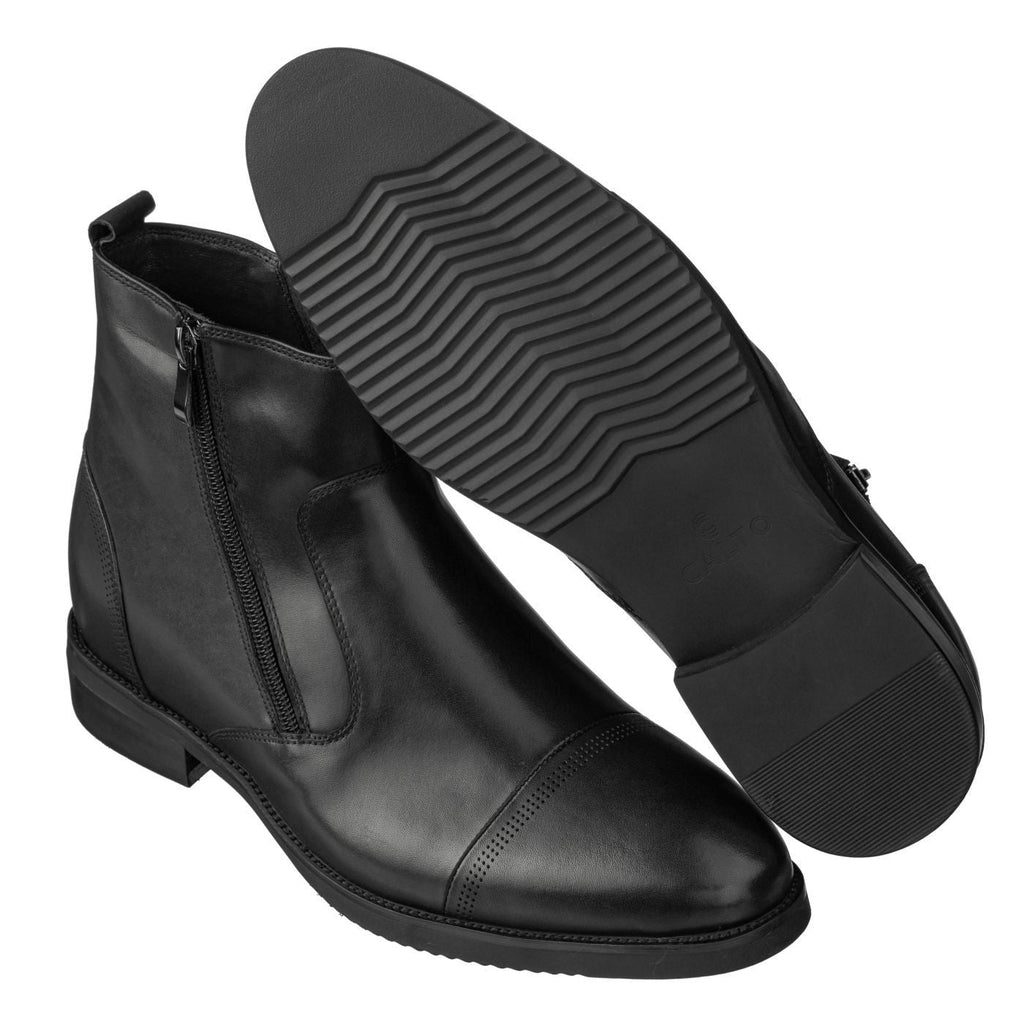 Black ankle boots with side zipper and textured tread sole, rear angle