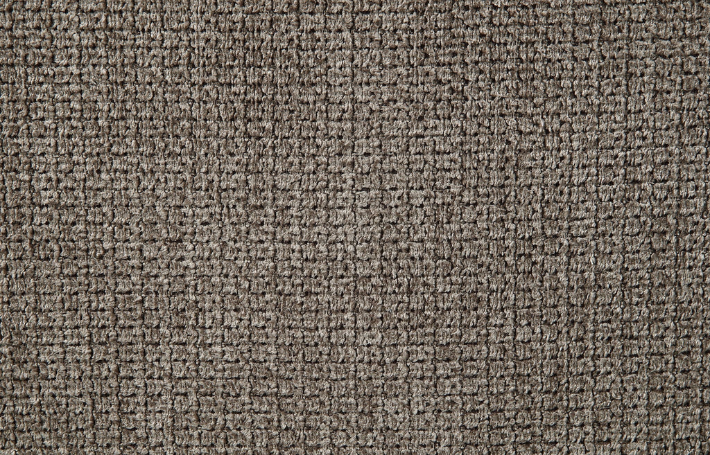 Close-up of dark brown textured upholstery fabric on the sofa