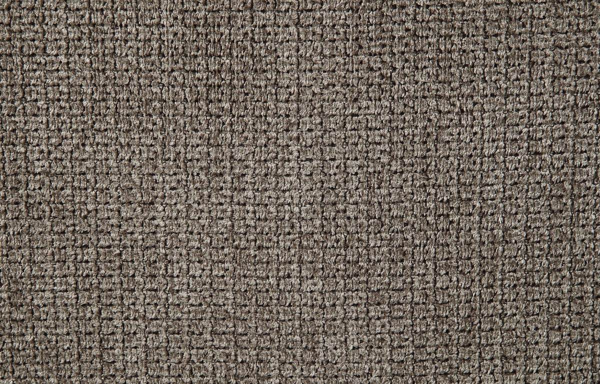 Close-up of dark brown textured upholstery fabric on the sofa