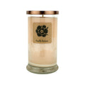 Vanilla extract soy candle in clear glass jar with gold lid, tan wax, flower label