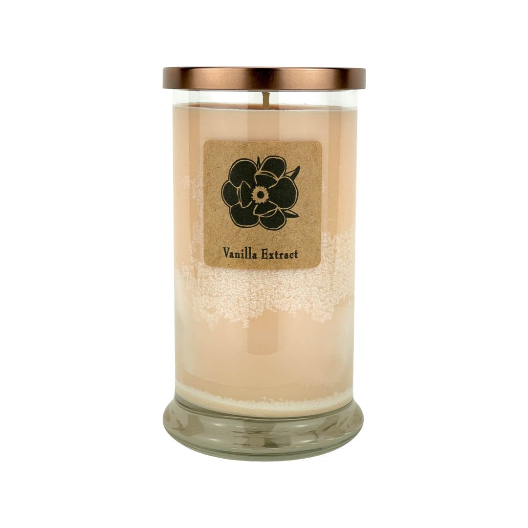 Vanilla extract soy candle in clear glass jar with gold lid, tan wax, flower label