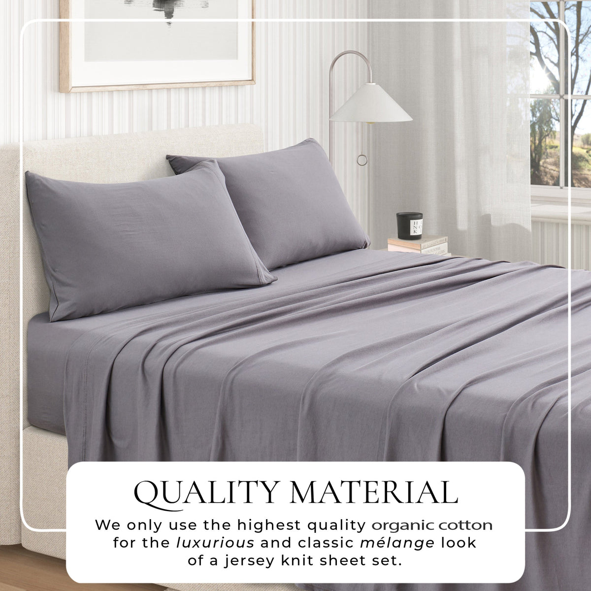 Jersey knit sheet set on bed with pillows, dark grey