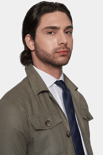 Olive safari coat with flap chest pocket and button detail at the collar