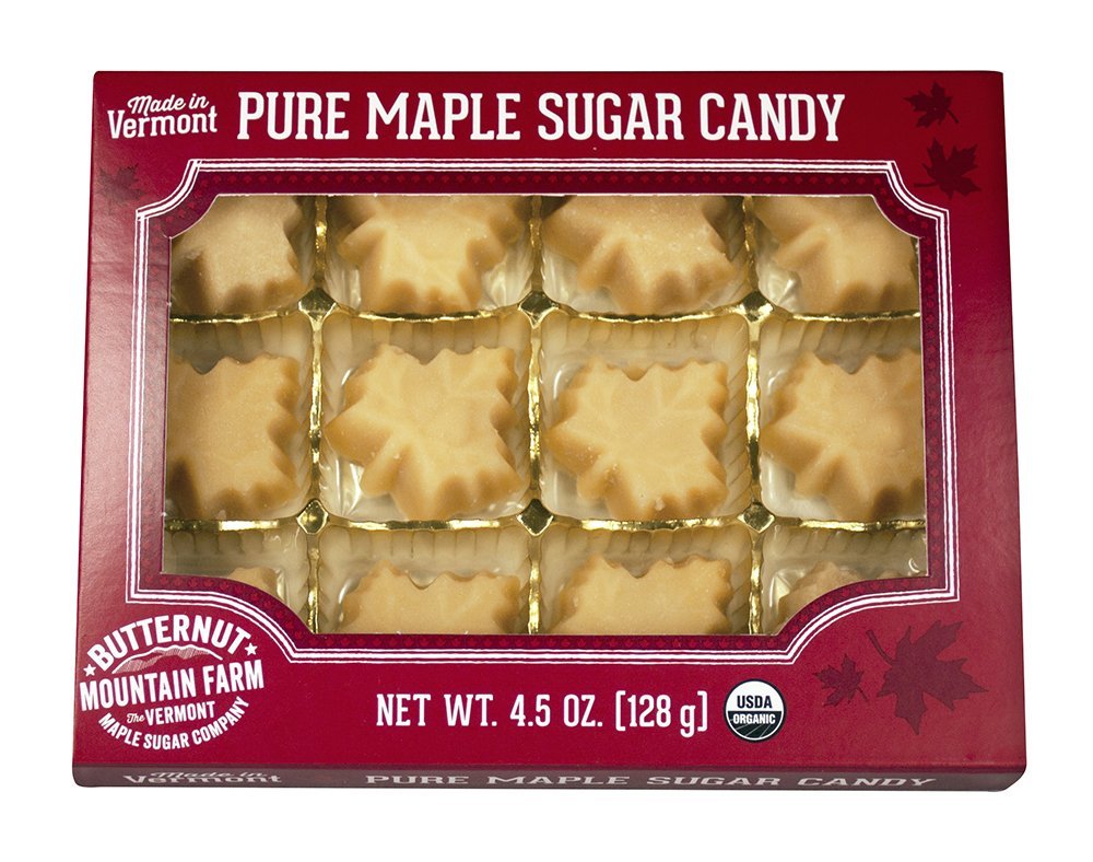 Box of pure maple sugar candy with molded caramel-colored pieces in clear window