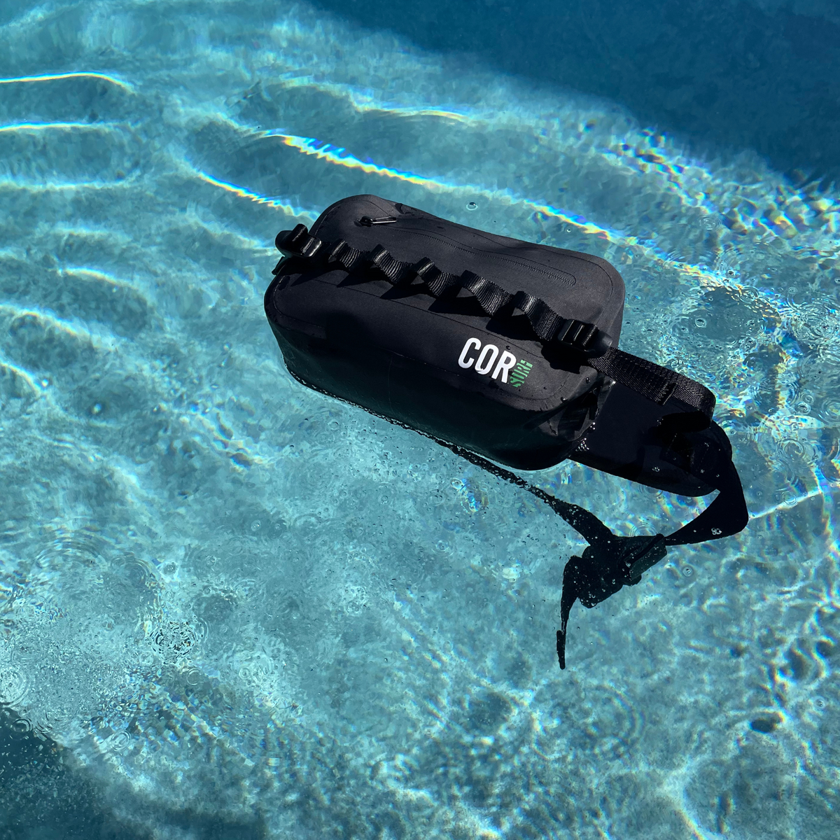 Black waterproof waist pack (2.5L) floating-style view with front zip pocket