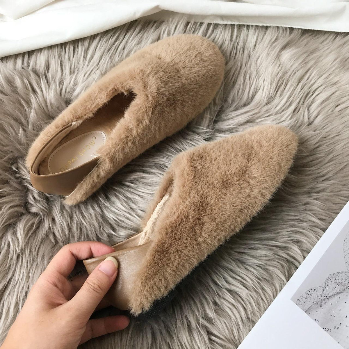 Brown fuzzy round-toe slip-on loafers with soft faux fur and tan interior lining