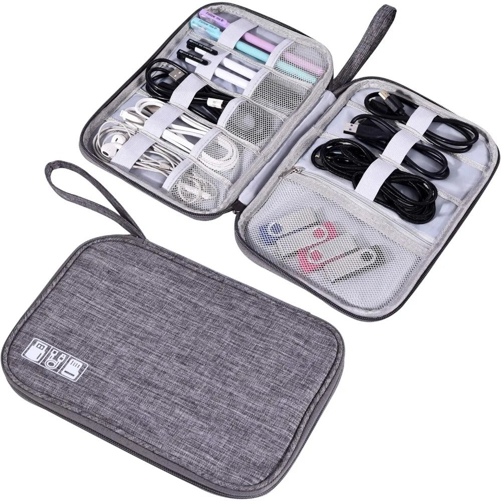 Grey waterproof electronics organizer bag open showing secured cable compartments and mesh pockets