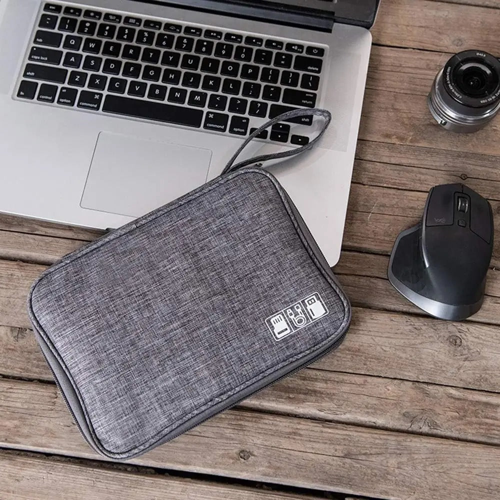 Grey electronics organizer bag with zipper and strap for storing charging cables