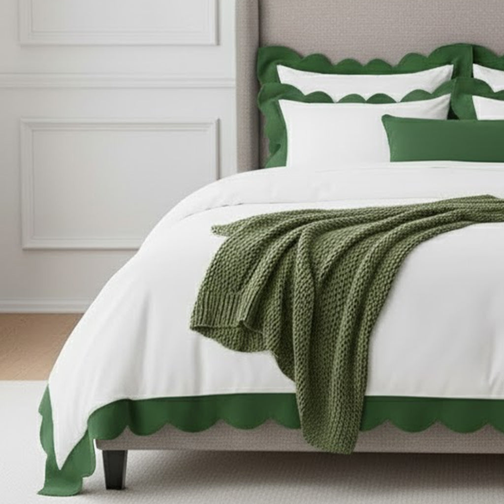 White cotton duvet cover with green scalloped wavy applique border, corner detail