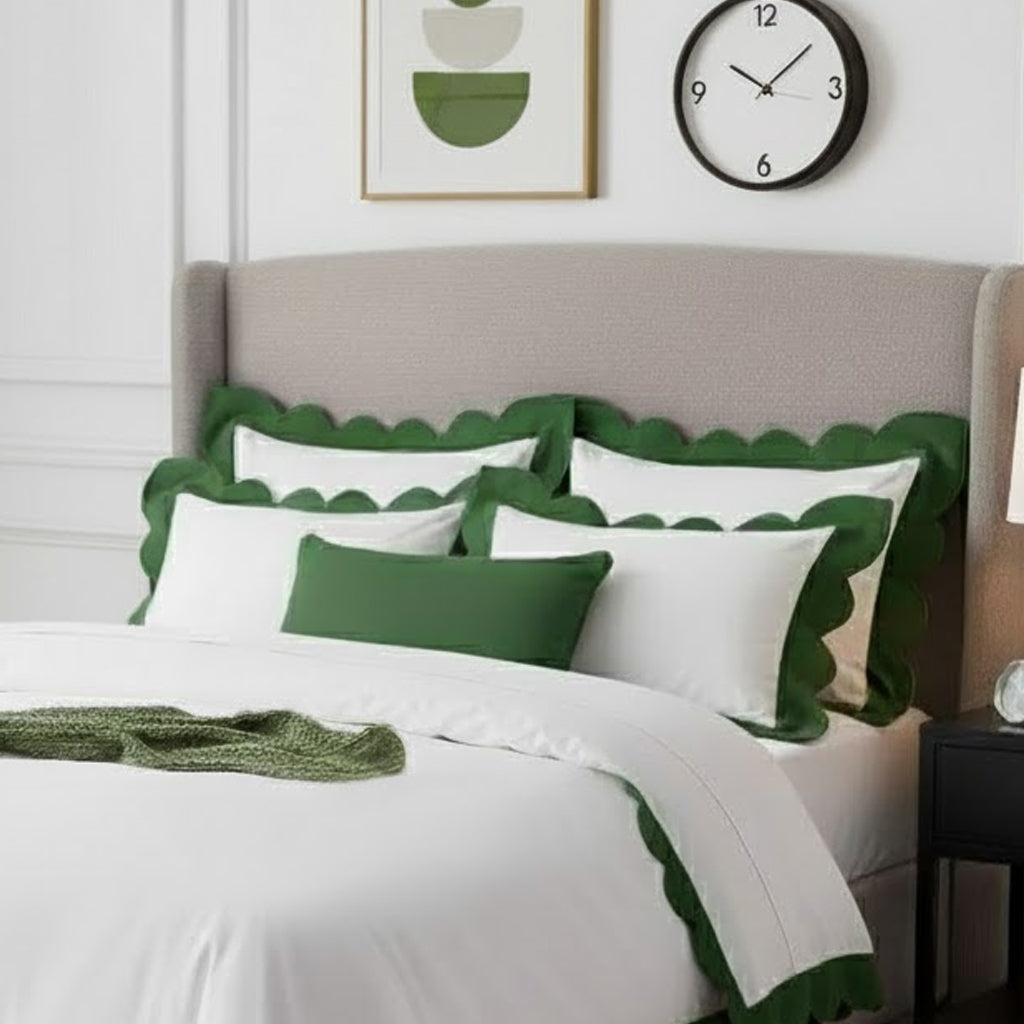 White duvet cover set with green wavy applique scalloped border, close-up on pillows