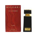 Black glass eau de parfum bottle with gold cap and red gift box