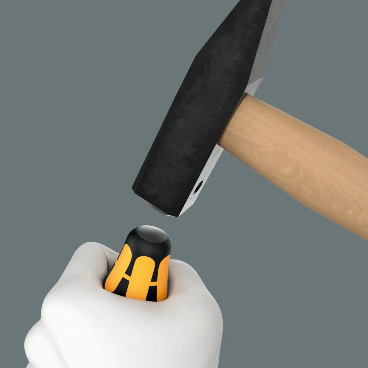 Wera screwdriver handle shown being struck with a hammer