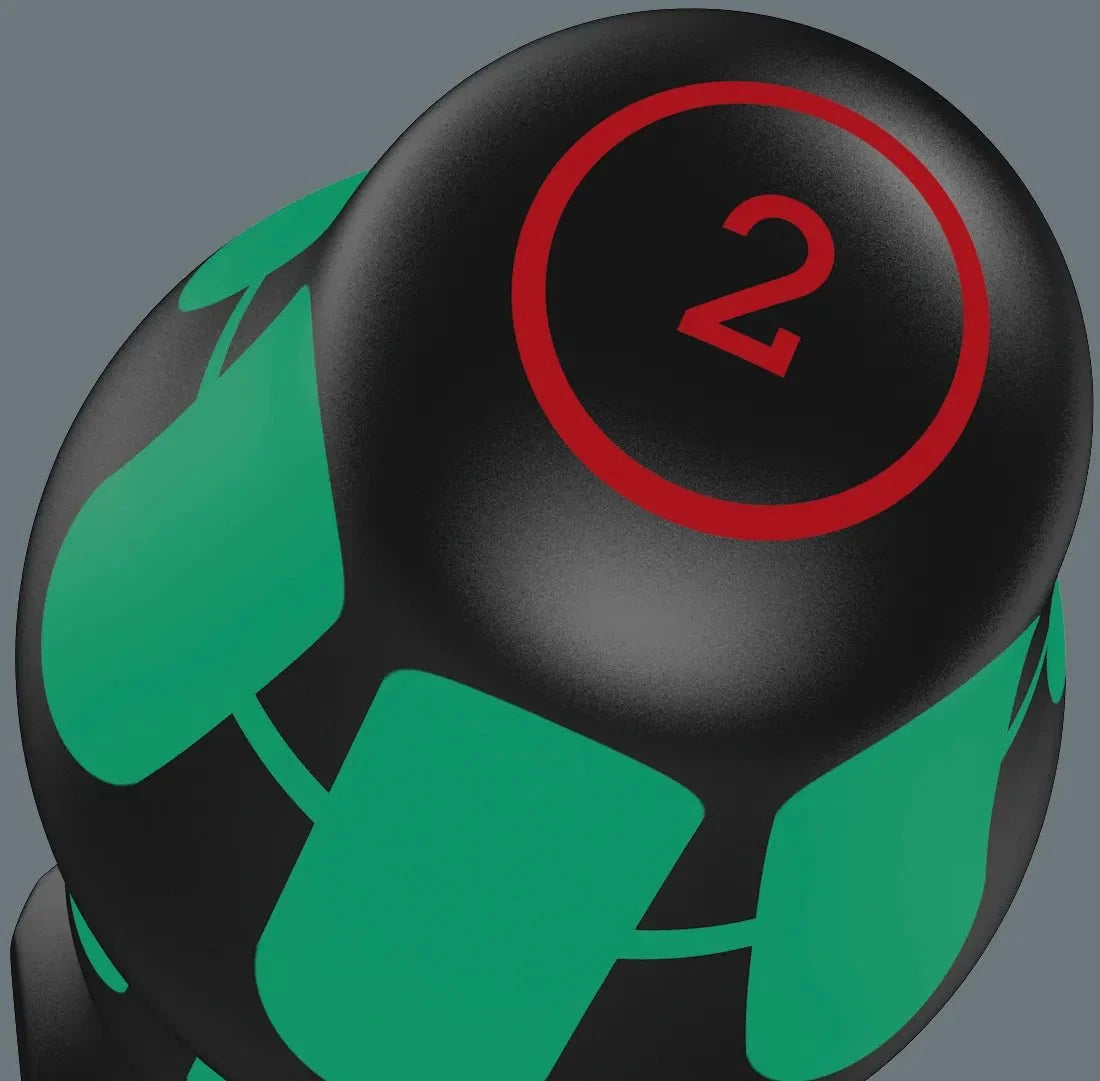 Close-up of a black Wera screwdriver handle with green grip panels