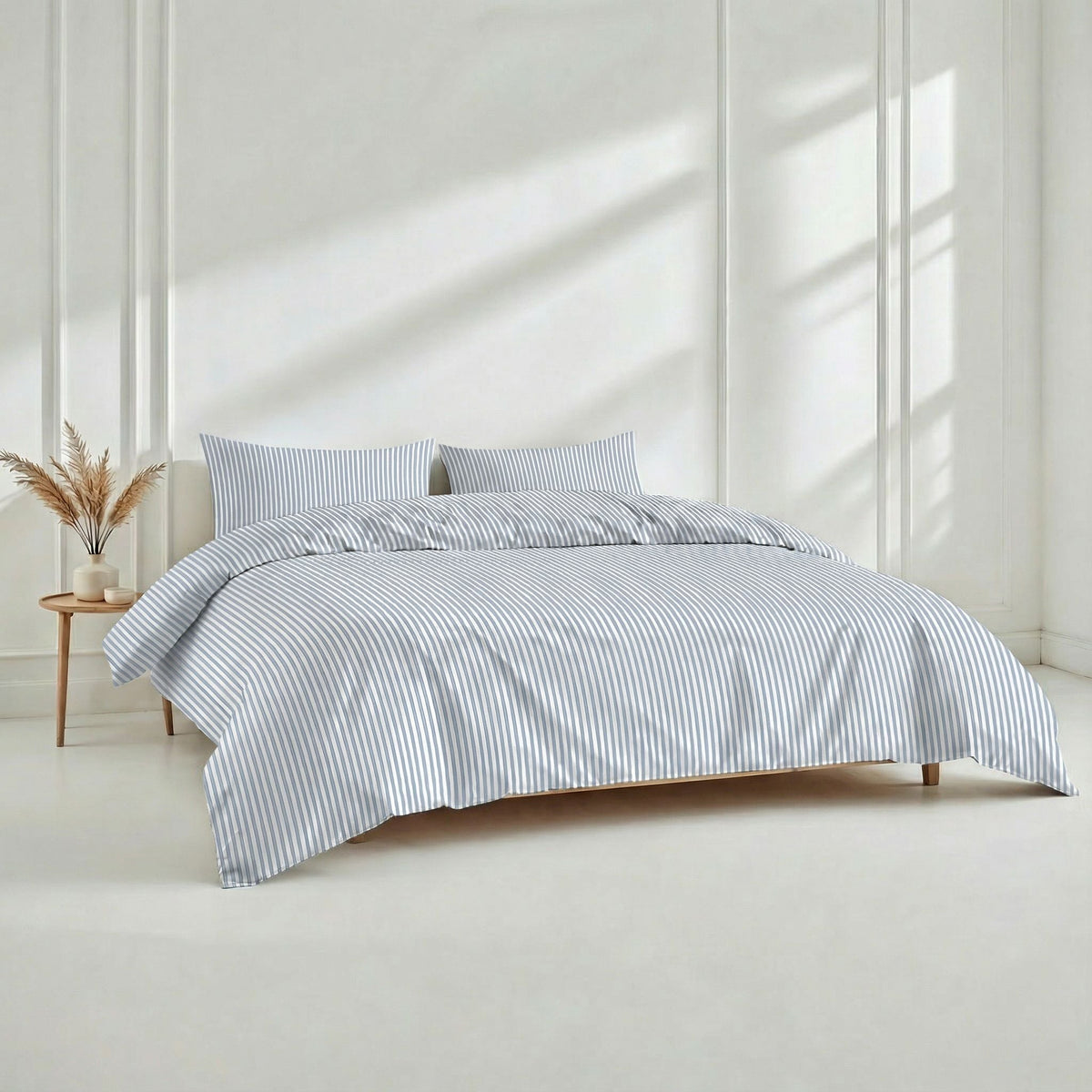 Light blue and white striped duvet cover with matching pillow shams