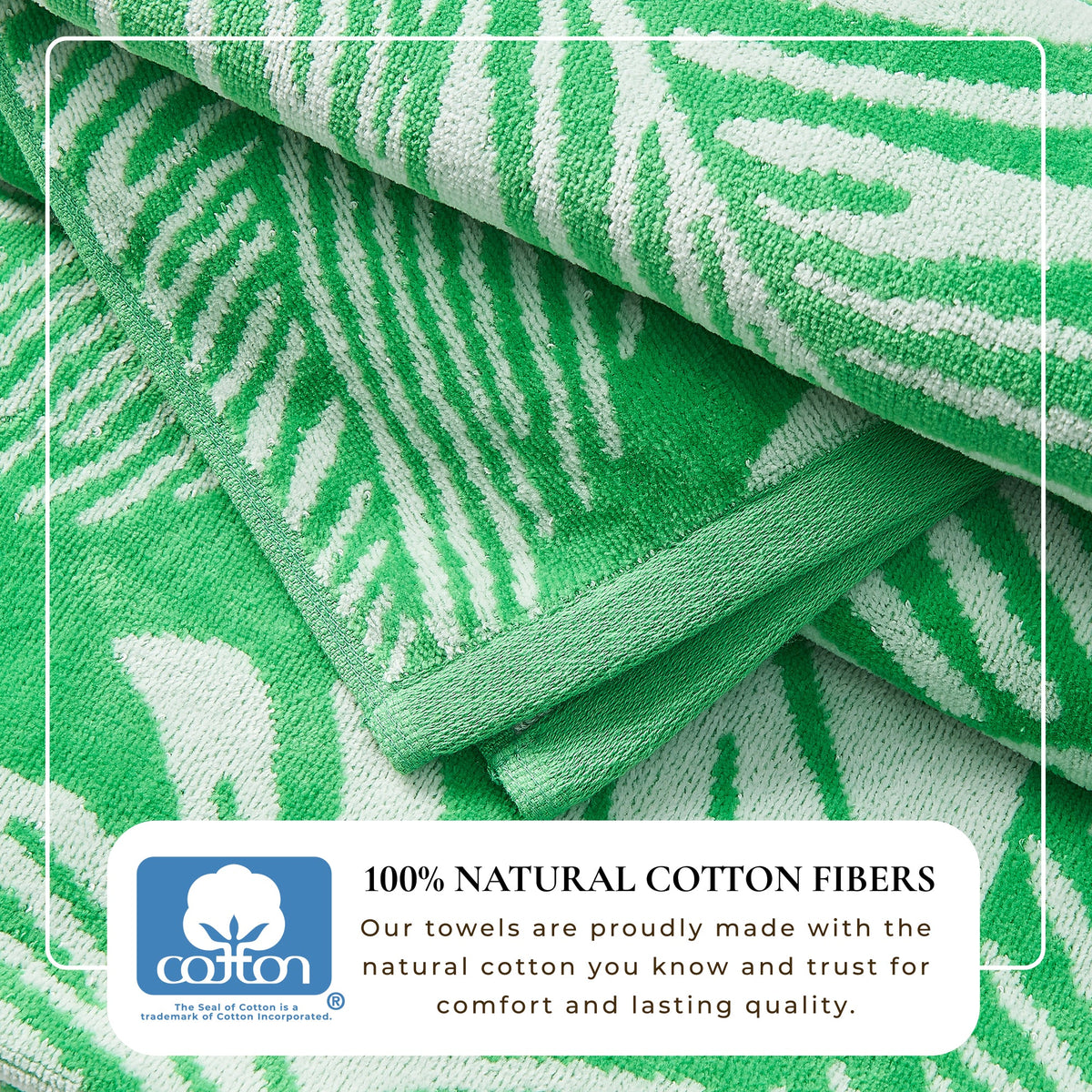 Green cotton velour towel fold with white leaf outline pattern