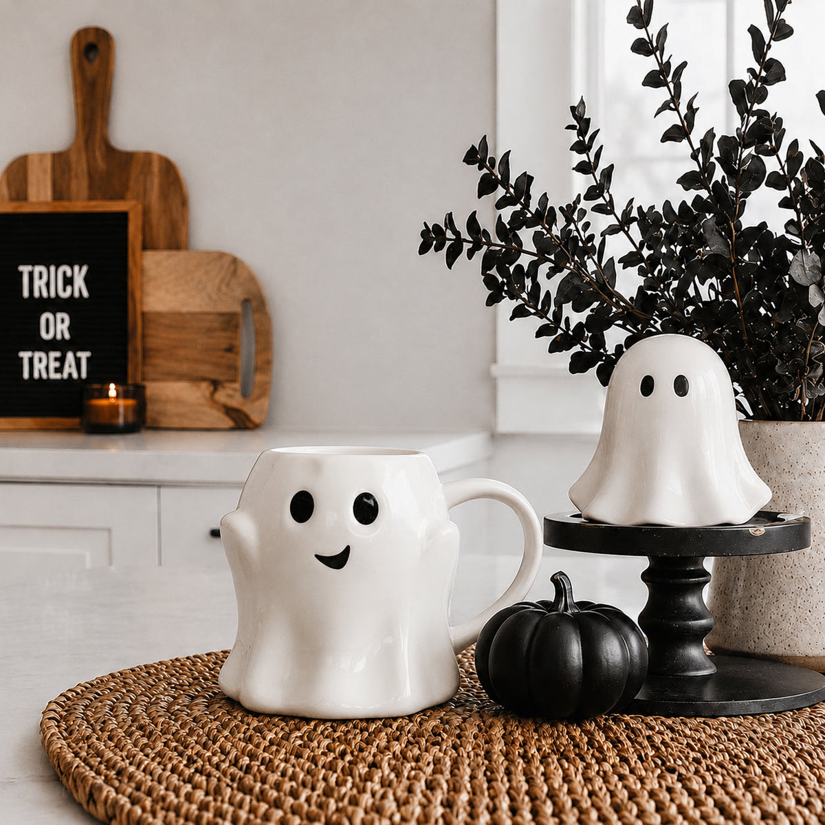 White ghost-shaped mug with smiley face and handle
